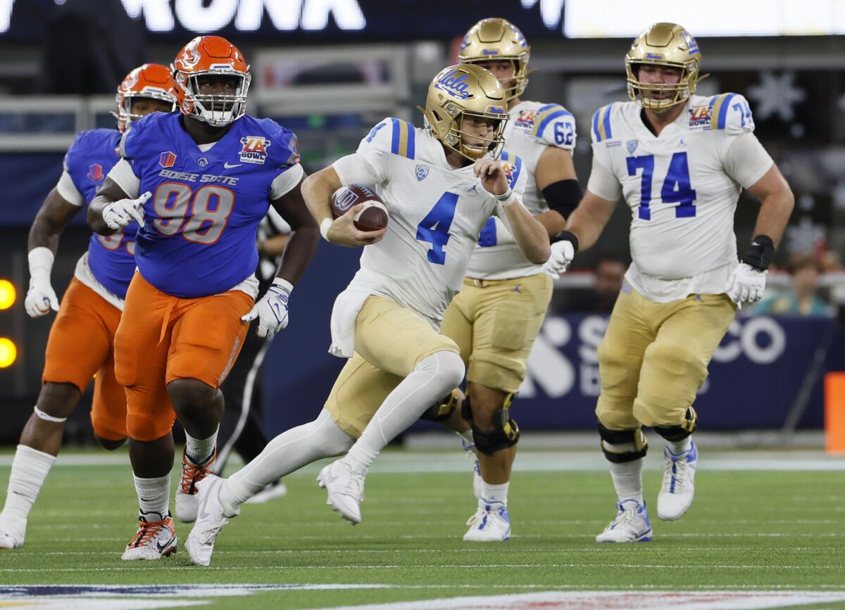 UCLA quarterback Ethan Garbers scrambles for a first down against Boise State in the L.A. Bowl in December.