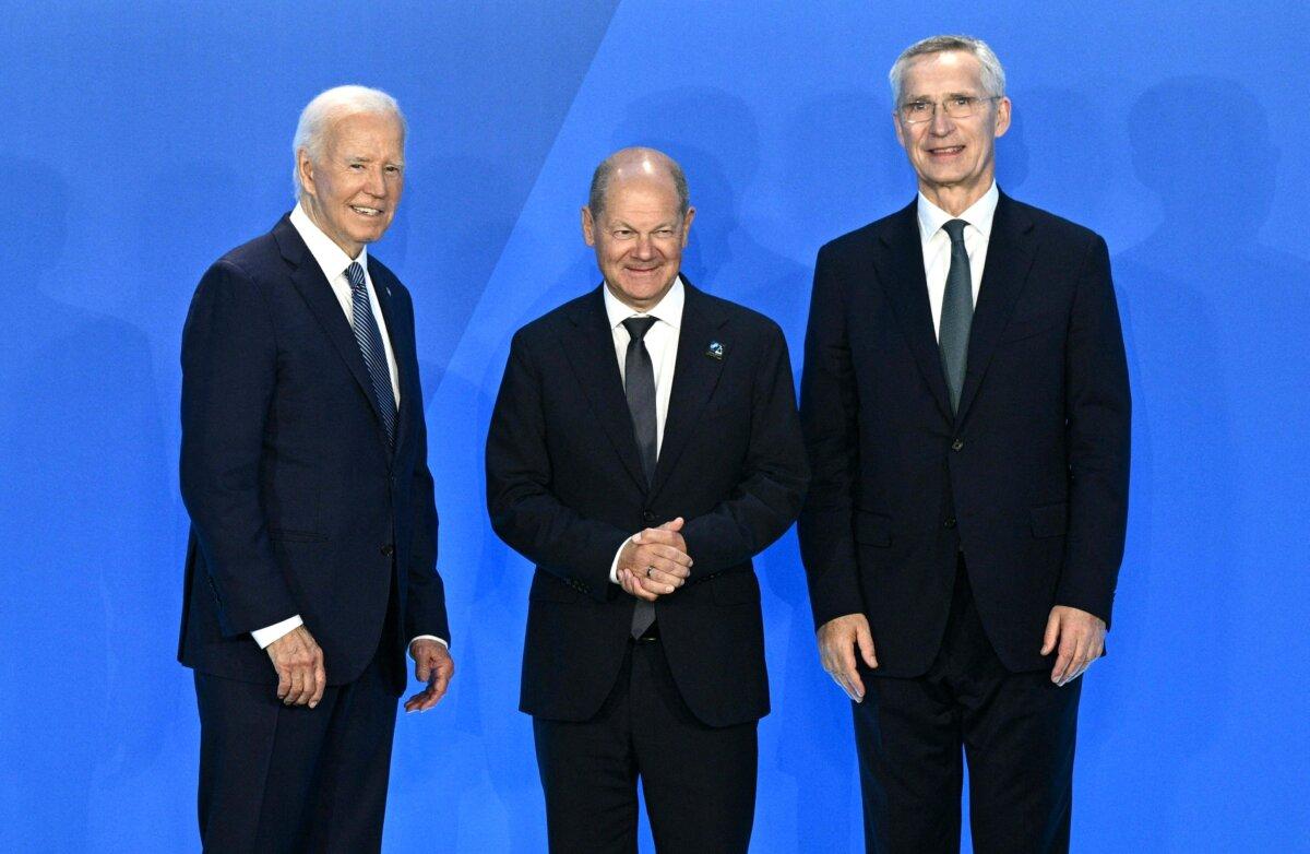 German Chancellor Olaf Scholz (C) is welcomed by U.S. President Joe Biden (L), and NATO Secretary General Jens Stoltenberg during the NATO 75th anniversary summit in Washington on July 10, 2024. (Brendan Smialowski/AFP via Getty Images)