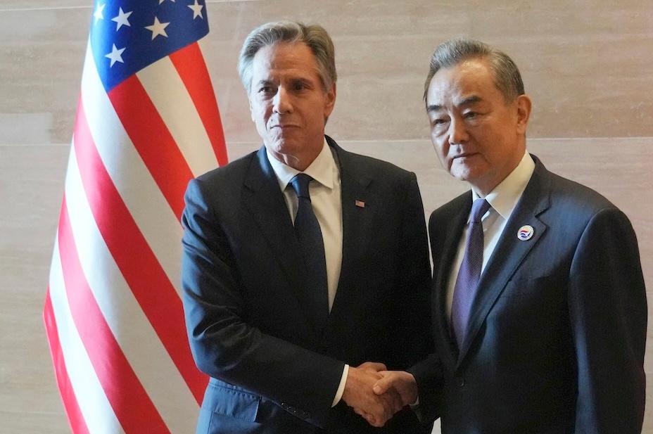 U.S. Secretary of State Antony Blinken (L) shakes hands with China's Foreign Minister Wang Yi as they meet on the sidelines of the 57th Association of Southeast Asian Nations (ASEAN) Foreign Ministers' Meeting in Vientiane, Laos, on July 27, 2024. (Achmad Ibrahim/Pool/AFP via Getty Images)