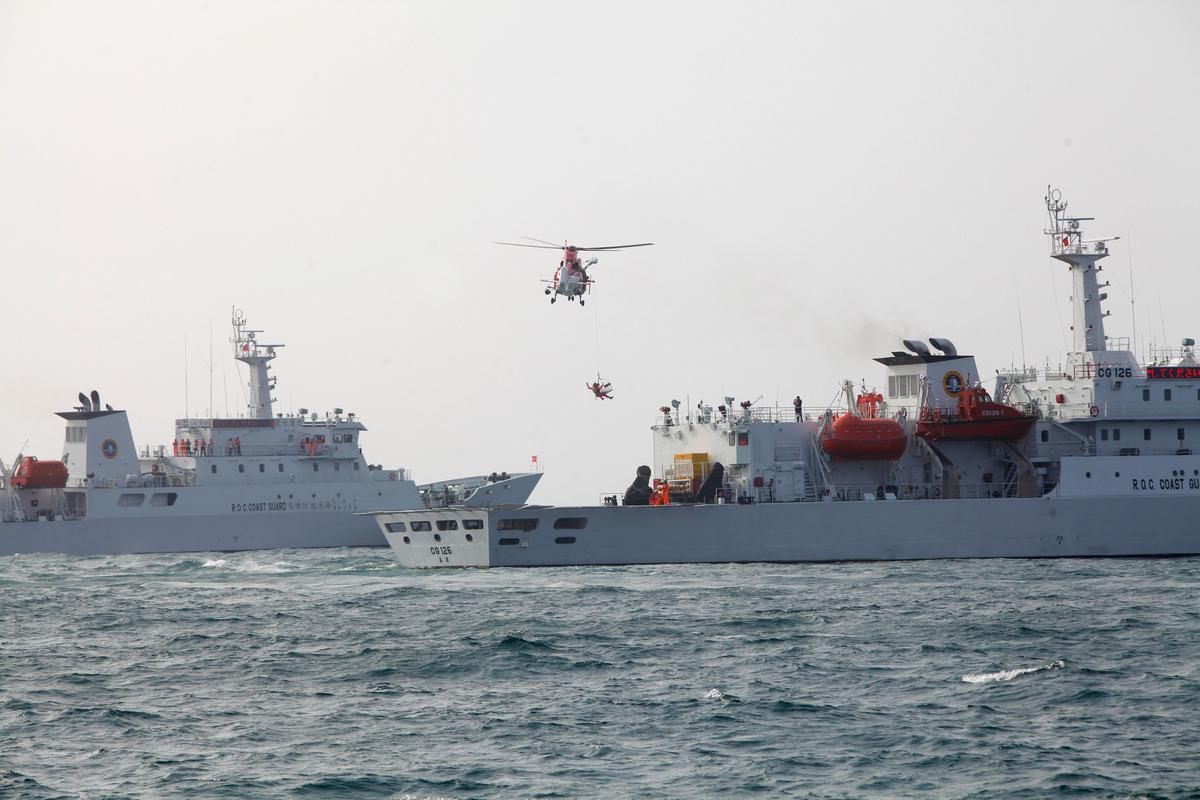 The Taiwanese coast guard takes part in a helicopter hoist operation exercise in Kaohsiung, Taiwan, on March 30, 2013. (Ashley Pon/Getty Images)