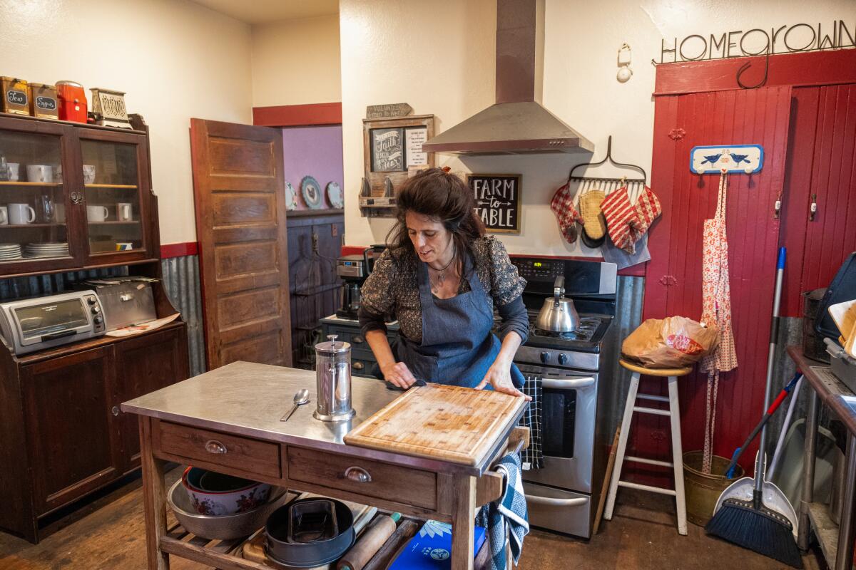 Anäis Dervaes tidies up the kitchen at her family's house. 