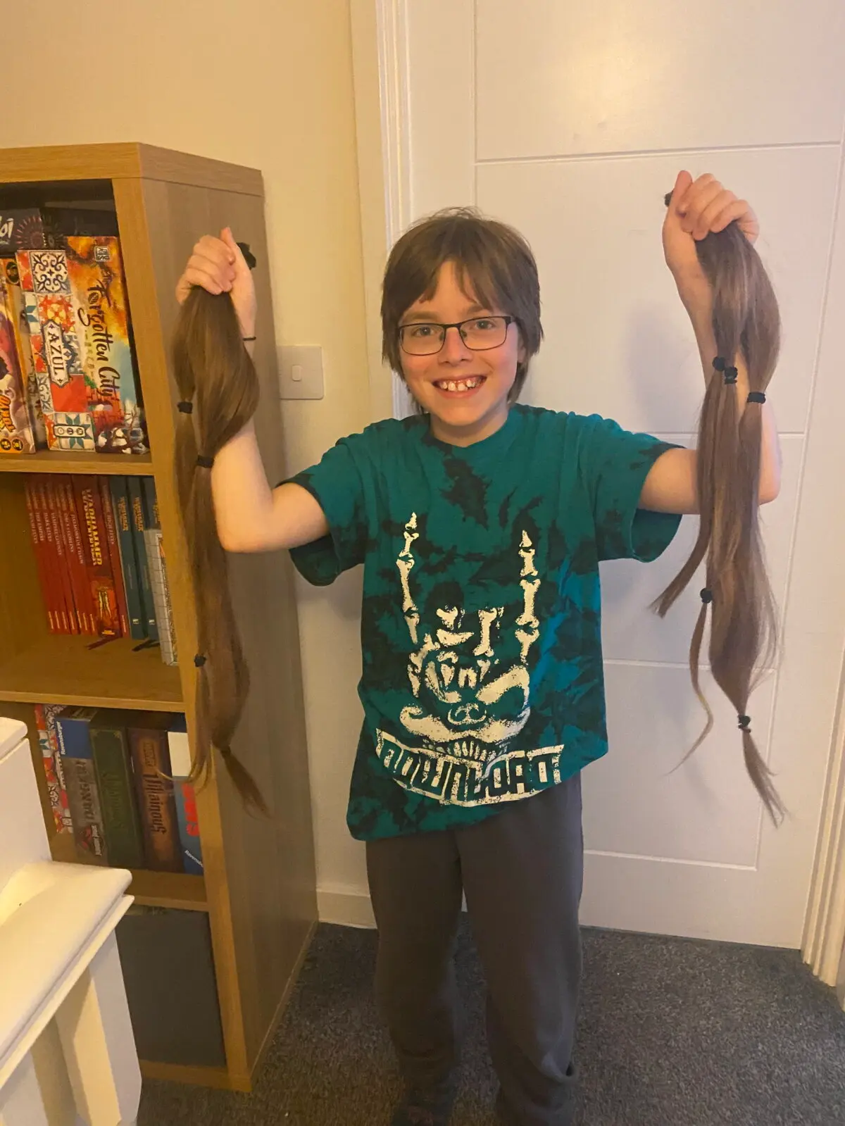 Aaron donated his hair to a charity. (SWNS)