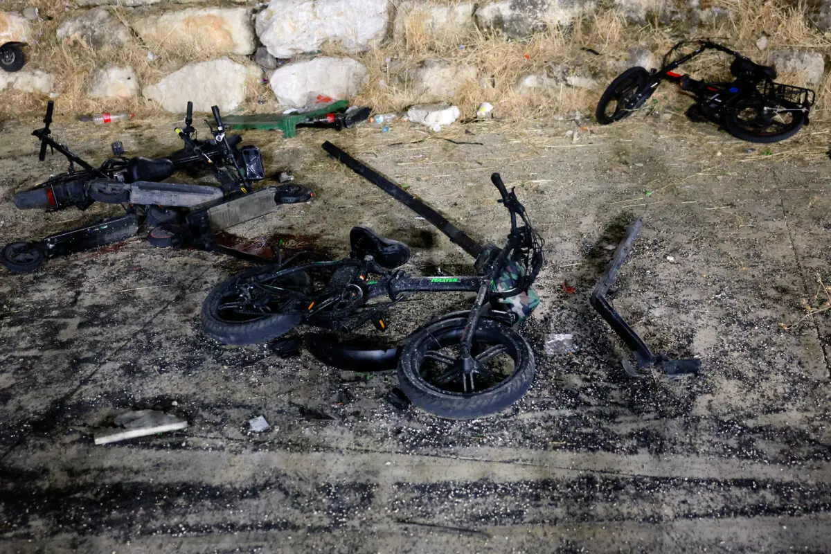 Damaged bikes are pictured after rockets were launched across Lebanon's border with Israel which, according to Israel's ambulance services, people were killed, at a soccer pitch in Majdal Shams, a Druze village in the Israeli-occupied Golan Heights, July 27, 2024. (Ammar Awad/Reuters)