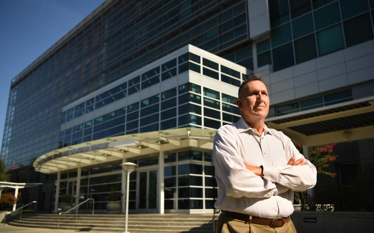  DMV director Steve Gordon stands outside the headquarters in Sacramento. 