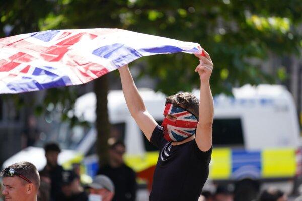 People protest outside Leeds Town Hall in Leeds, England, on Aug. 3, 2024. (Owen Humphreys/PA Wire)