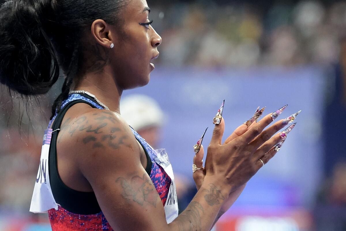 American Sha'carri Richardson claps after winning the silver medal in the women's 100-meter dash 