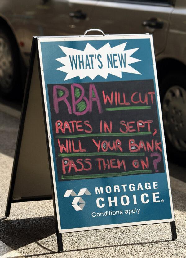 A mortgage broker's advertising sign stands on the street in Melbourne, Australia. Some commentators expect the Reserve Bank of Australia to lower interest rates in September. (Mark Dadswell/Getty Images)