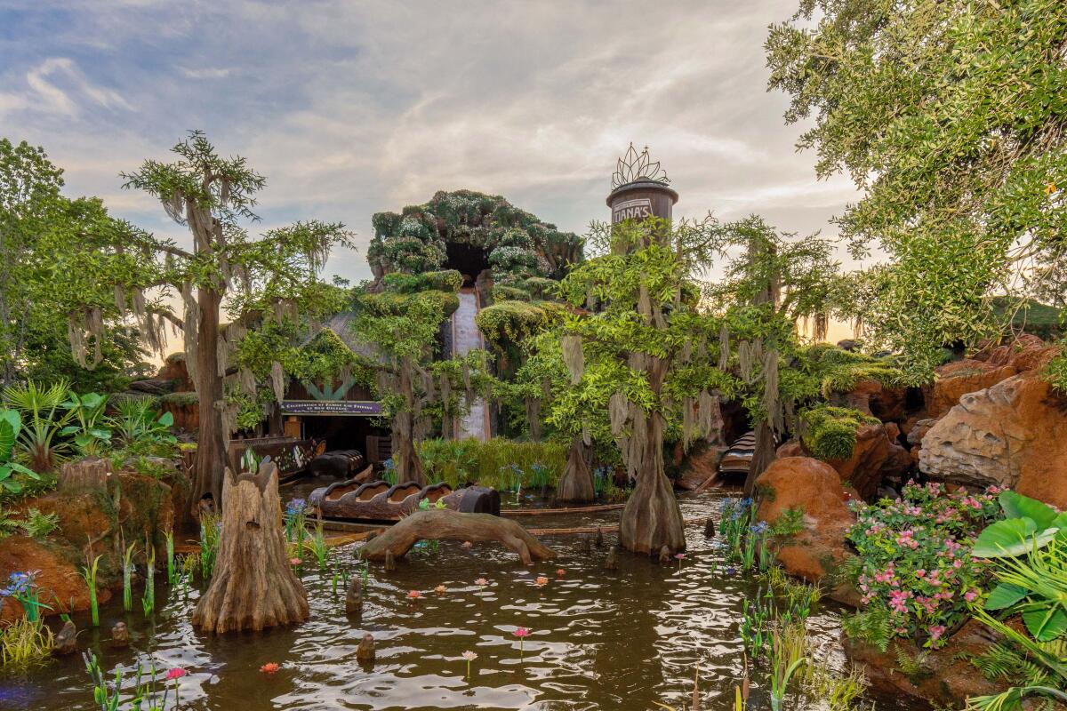 A lushly green mountain that hosts a 50-foot log flume drop. 