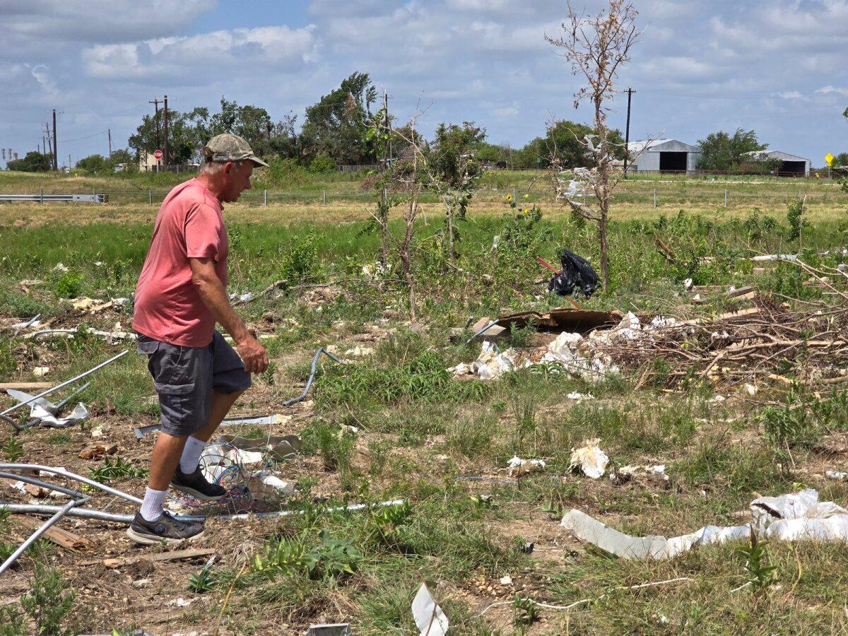 Paul Sperry, 59, walks through a trail of debris from an EF-3 tornado that ripped through Valley View, Texas on May 25, 2024, killing seven people and injuring dozens. Photo taken on July 29, 2024. (Allan Stein/The Epoch Times)