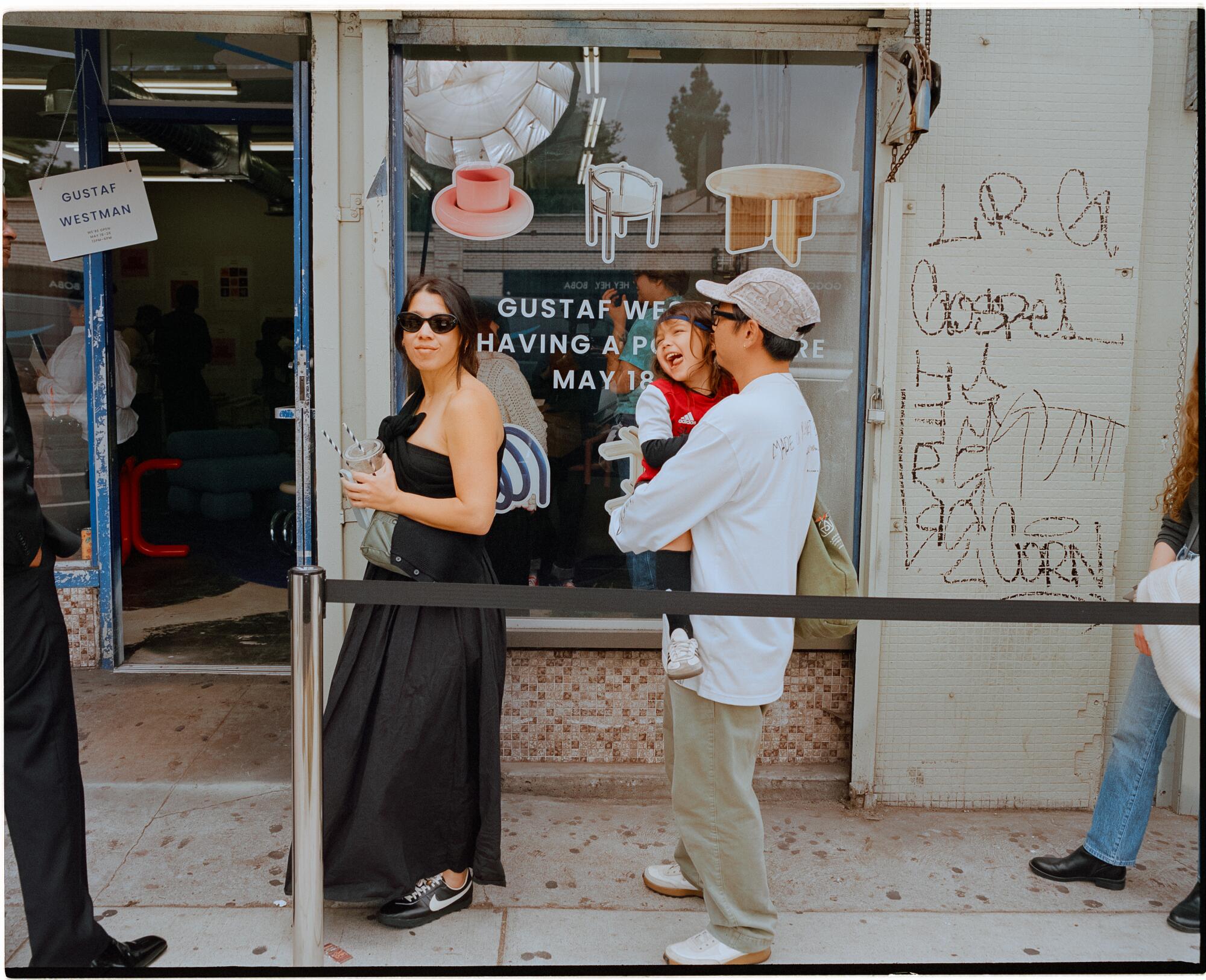 A family waits in line.