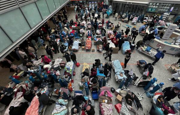 Patients on beds set up in the atrium area of a busy hospital in Shanghai, China, on Jan. 13, 2023. (Kevin Frayer/Getty Images)