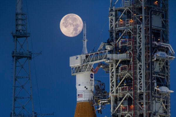 The Artemis I Space Launch System (SLS) and Orion spacecraft, atop the mobile launcher, are prepared for a wet dress rehearsal to practice timelines and procedures for launch at Launch Complex 39B at NASA's Kennedy Space Center, Fla., on June 14, 2022. (Cory Huston/NASA via AP)