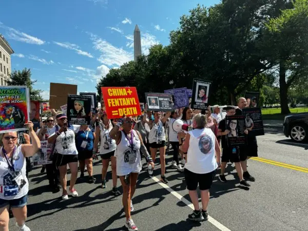 Attendees of "The Lost Voice of Fentanyl" rally march in Washington on July 13, 2024. (Joseph Lord/The Epoch Times)