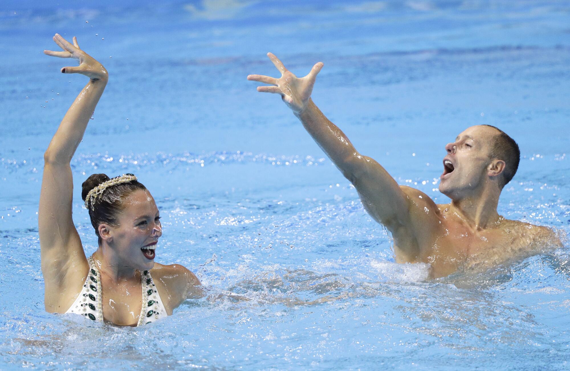 Americans Bill May and Natalia Vega Figueroa perform during the mixed duet free final at the World Swimming Championships 