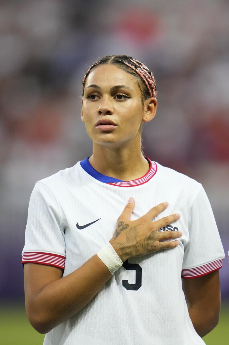 U.S. women's soccer player Trinity Rodman stands during the playing on the national anthems before a match against Zambia.