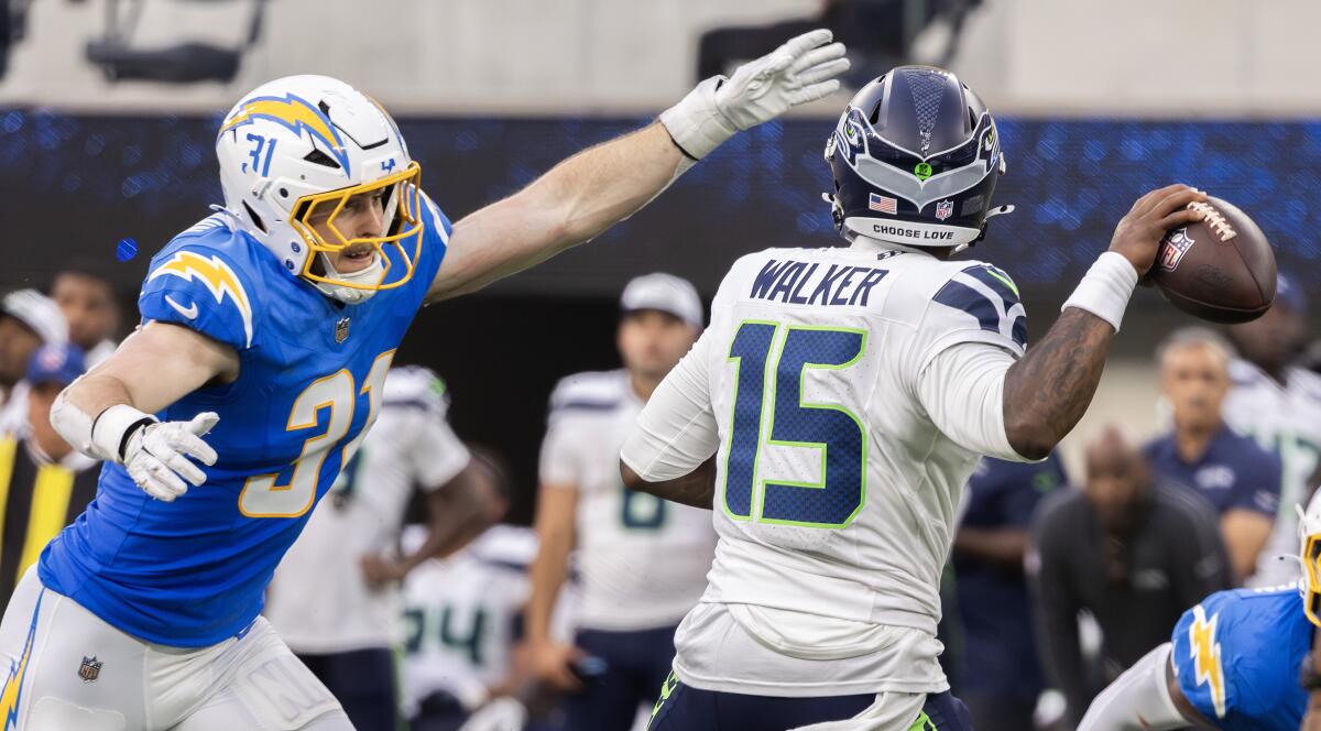 Chargers linebacker Nick Niemann pressures Seahawks quarterback PJ Walker during the third quarter.