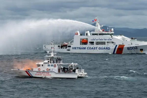 A Vietnamese Coast Guard ship fires a water cannon during a joint maritime exercise between the Philippine Coast Guard and Vietnamese Coast Guard, in the waters of Bataan Province, Philippines, on Aug. 9, 2024. (Lisa Marie David/Reuters)