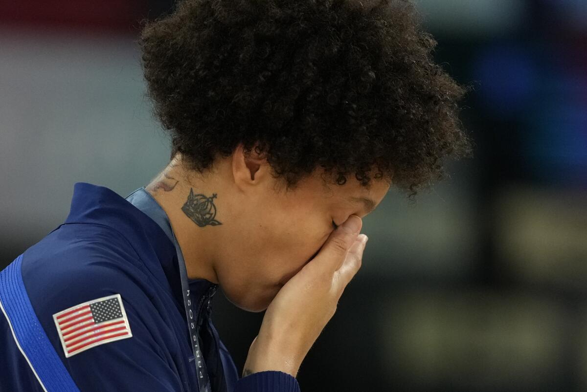 American Brittney Griner wipes a tear after hearing the national anthem 