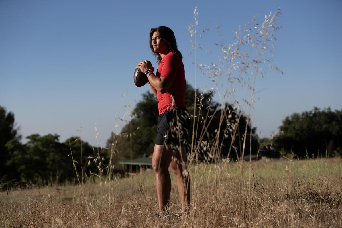 Murrieta Valley quarterback Bear Bachmeier poses for a photo on his family's three-acre plot of land.