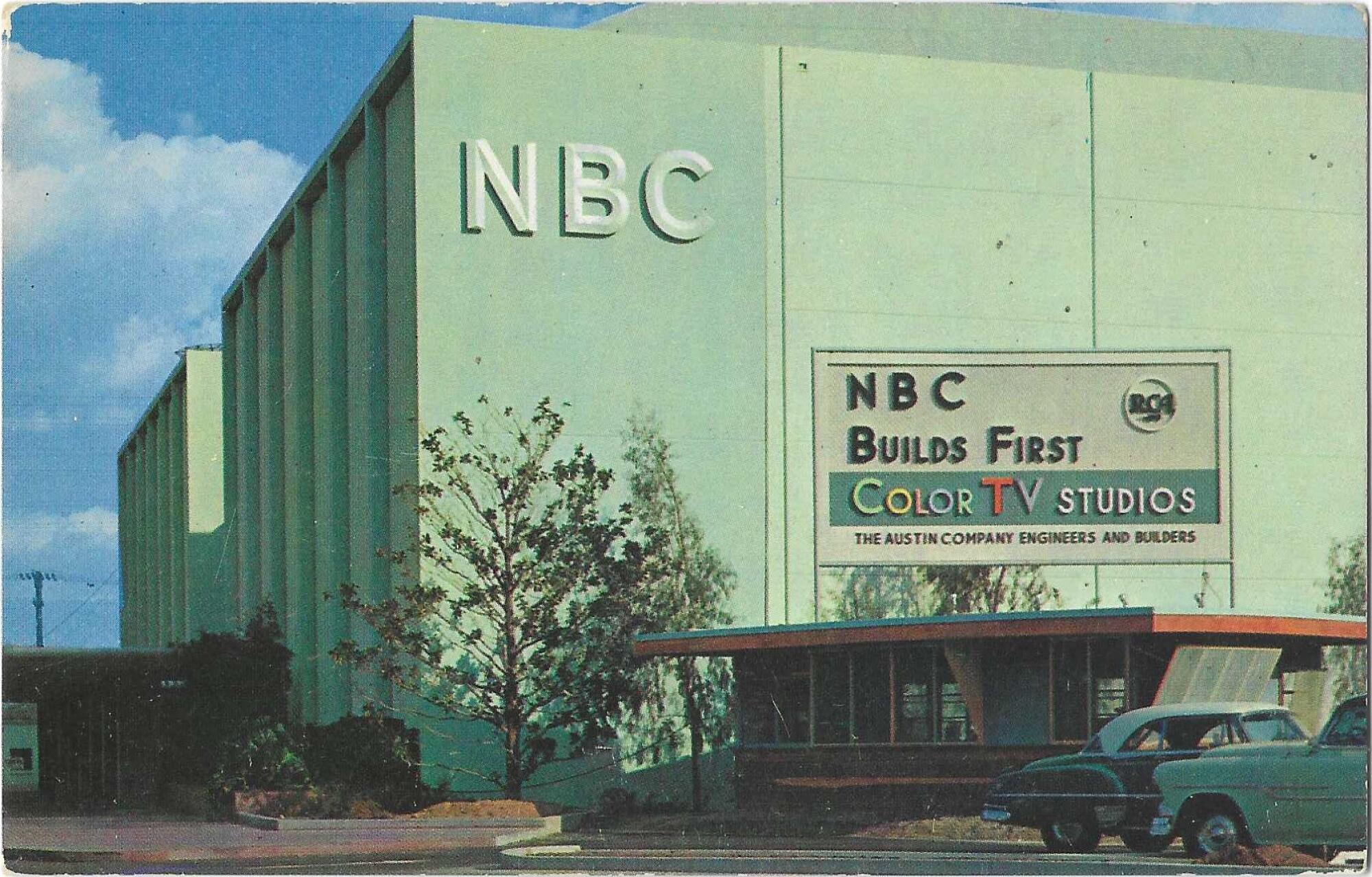 An old postcard of a green building with a sign: "NBC builds first color TV studios." 