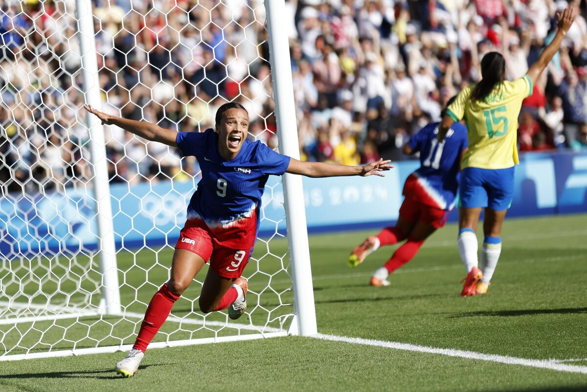 American Mallory Swanson celebrates after scoring during the U.S. win over Brazil in the gold-medal 