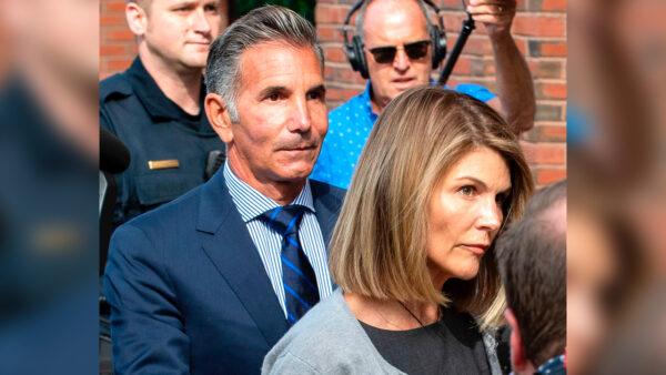 Actress Lori Loughlin and husband Mossimo Giannulli exit the Boston Federal Courthouse after a pre-trial hearing with Magistrate Judge Kelley at the John Joseph Moakley U.S. Courthouse in Boston, Mass., on Aug. 27, 2019. (Joseph Prezioso/AFP/Getty Images)