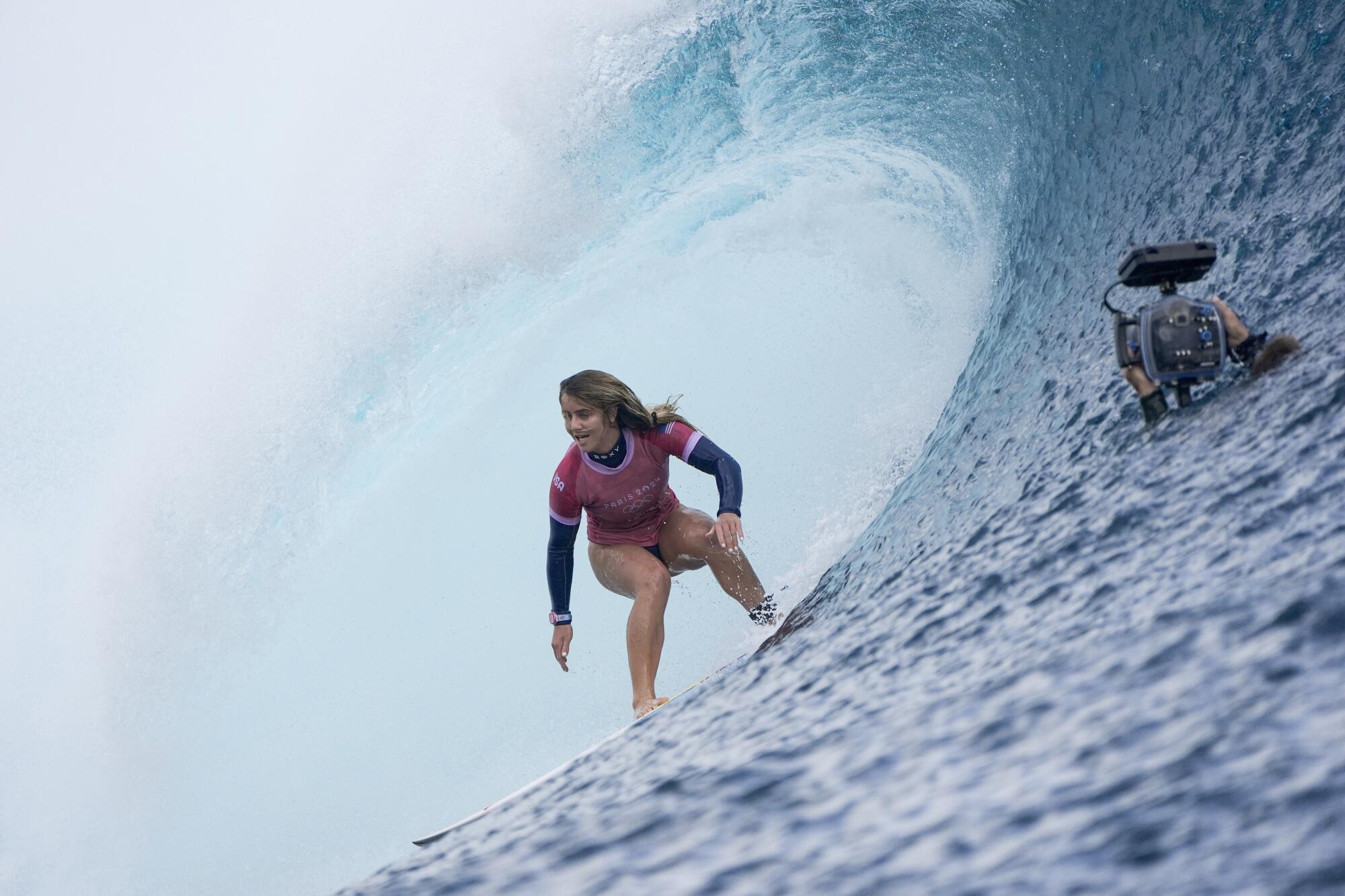 U.S. surfer Caroline Marks rides a wave en route to winning the Olympic gold medal on Monday.