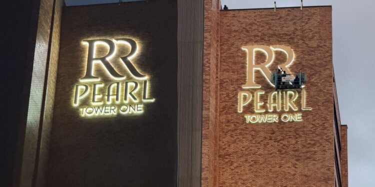 PICTORIAL: Tycoon Sudhir’s RR Pearl Tower One Signage Finally Goes Up in Kampala Skies